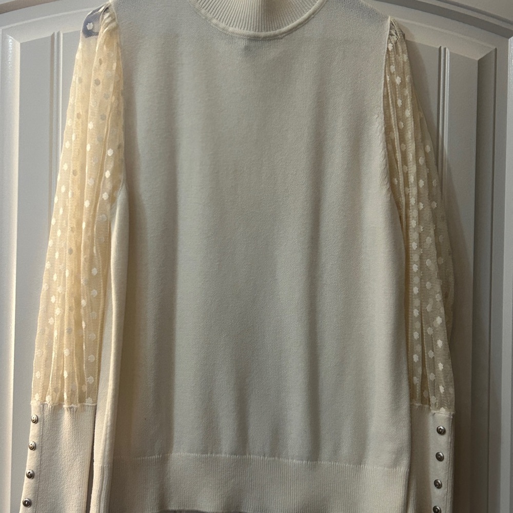 Elegant Cream Sweater with Sheer Polka Dot Sleeves